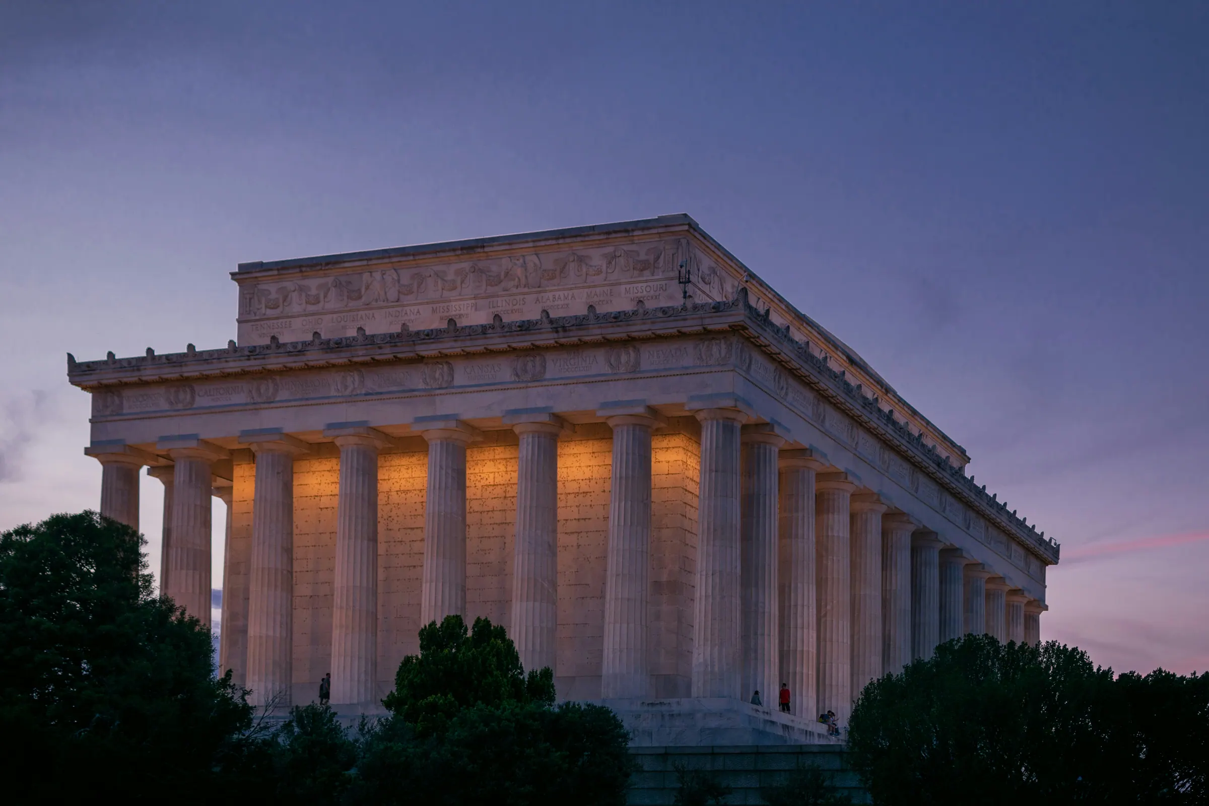 The Lincoln Memorial's colonnade lit from within at dusk